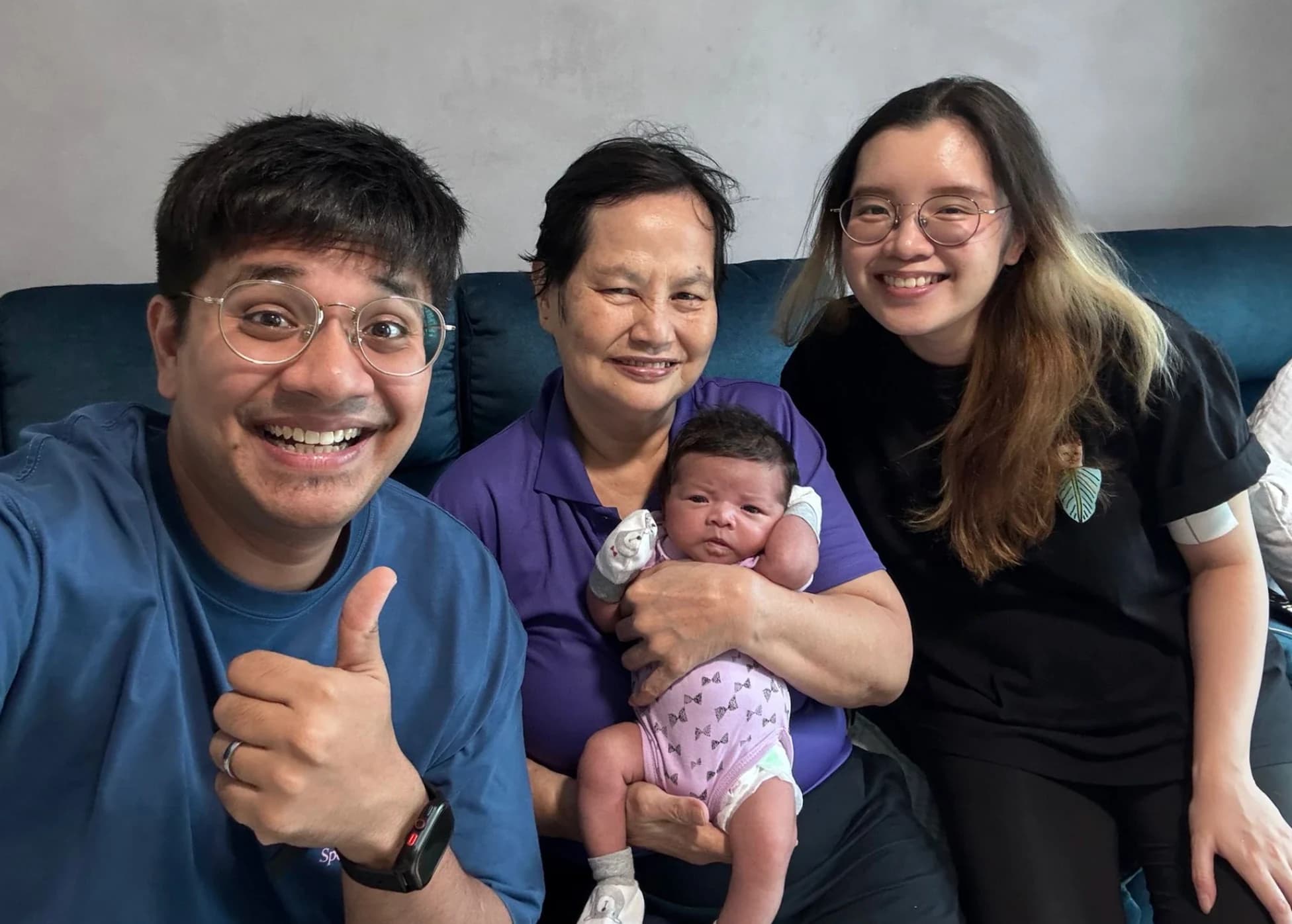 A family with their NannyMoon confinement nanny and newborn