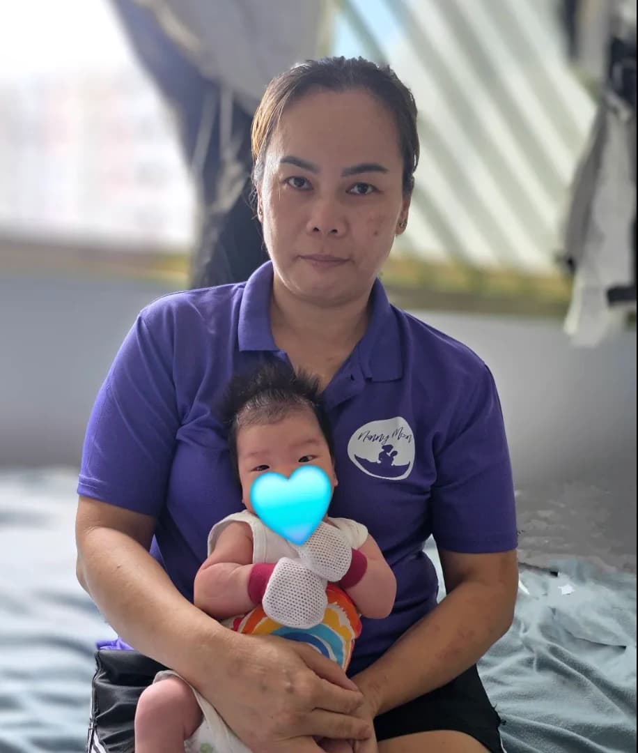 A family with their NannyMoon confinement nanny and newborn