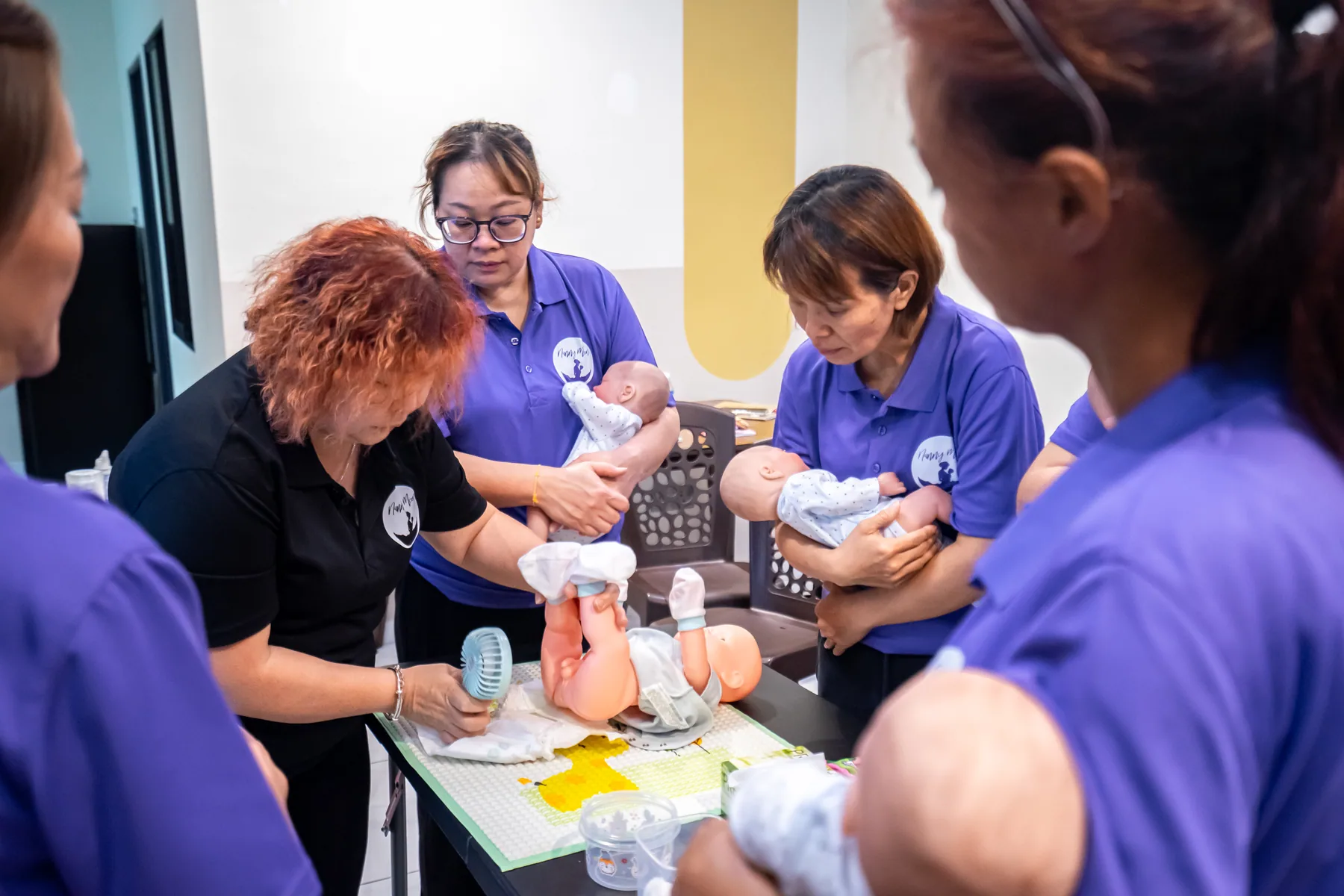 Nannies practising safe newborn feeding