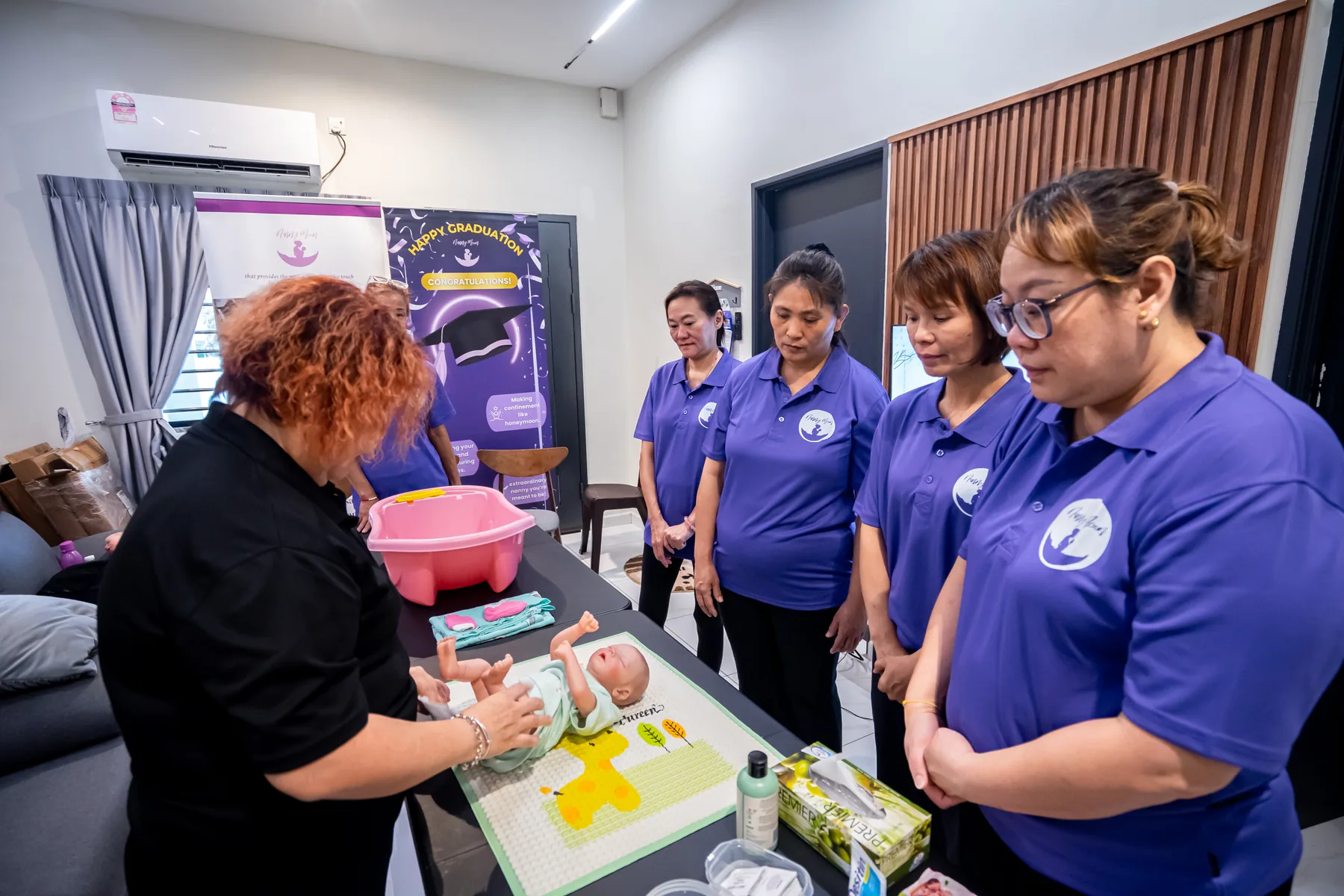 Nanny candidates preparing for a practical training session